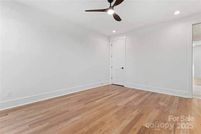 empty room with ceiling fan, baseboards, light wood finished floors, and recessed lighting