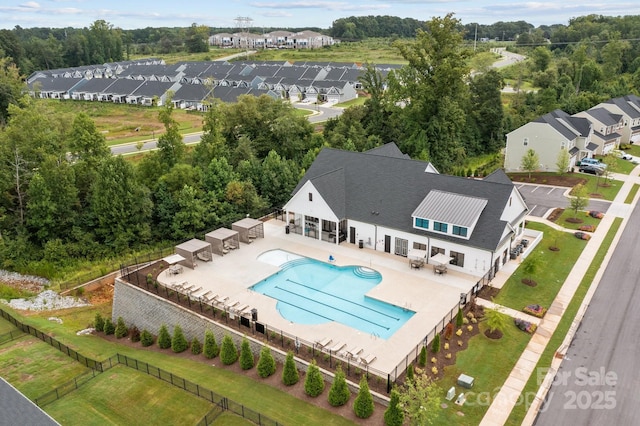 birds eye view of property with a residential view