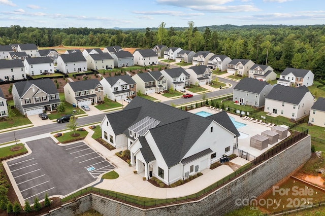 aerial view with a residential view and a view of trees