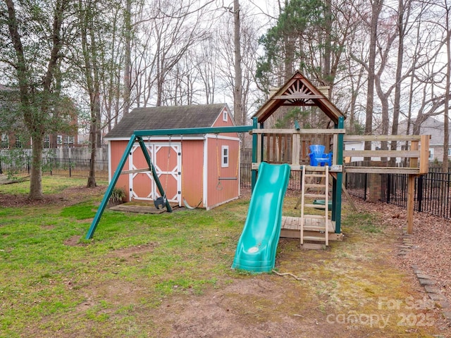 view of play area with an outbuilding, a lawn, a storage shed, and a fenced backyard