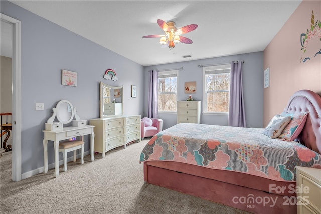 bedroom with carpet flooring, baseboards, visible vents, and ceiling fan