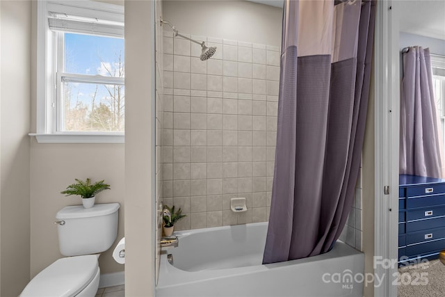 bathroom featuring toilet and shower / bath combination with curtain