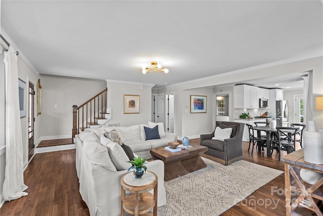 living area featuring dark wood finished floors, stairway, crown molding, and baseboards