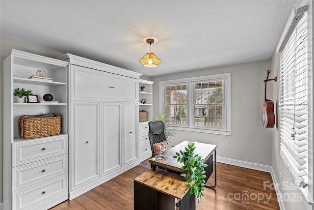 office space featuring baseboards and dark wood finished floors