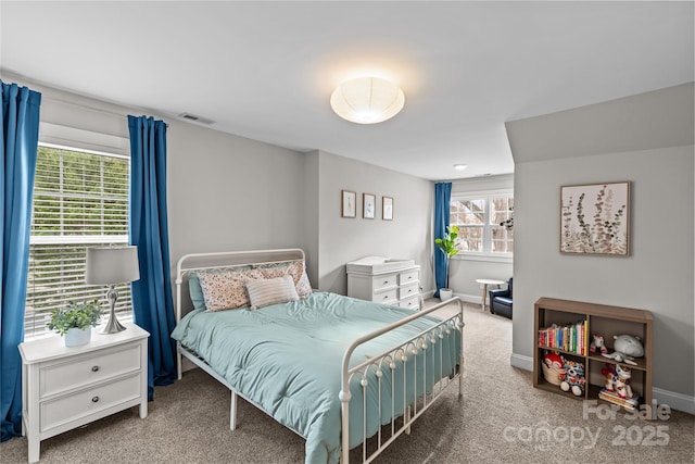 bedroom with visible vents, baseboards, and carpet floors