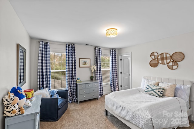 carpeted bedroom with visible vents