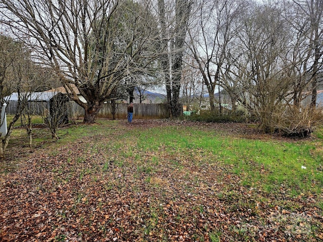 view of yard with fence