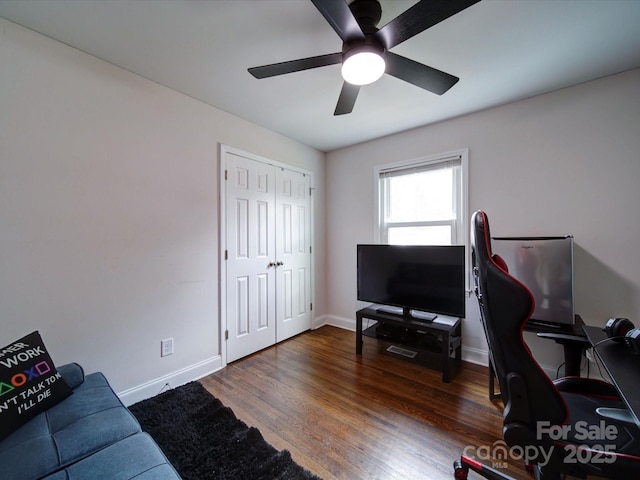 office with baseboards, wood finished floors, and a ceiling fan