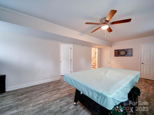 playroom with wood finished floors, baseboards, ornamental molding, pool table, and ceiling fan