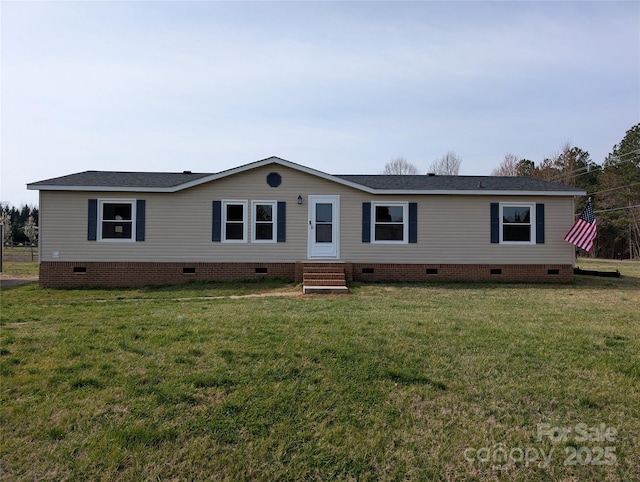 manufactured / mobile home featuring entry steps, a front lawn, and crawl space