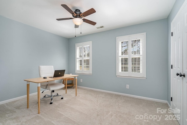 office area featuring visible vents, baseboards, carpet, and ceiling fan