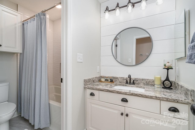 bathroom featuring toilet, vanity, and shower / bathtub combination with curtain