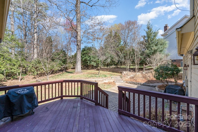 wooden terrace featuring grilling area