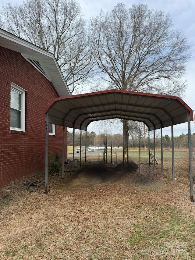 view of parking with a detached carport