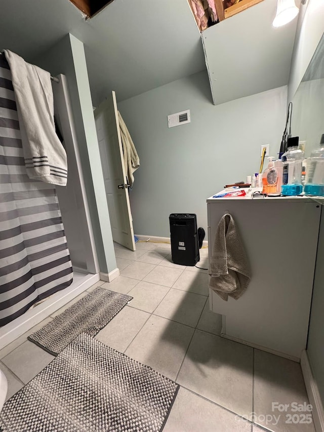 full bath with visible vents, baseboards, a stall shower, and tile patterned flooring