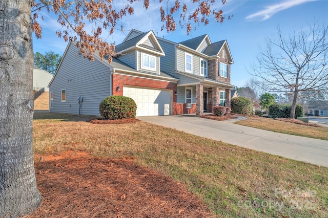 traditional-style house with brick siding, concrete driveway, and a front lawn