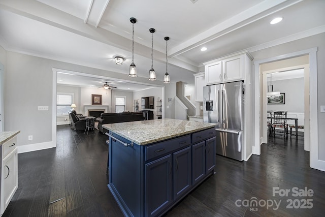kitchen featuring beam ceiling, stainless steel fridge with ice dispenser, white cabinetry, blue cabinets, and dark wood finished floors
