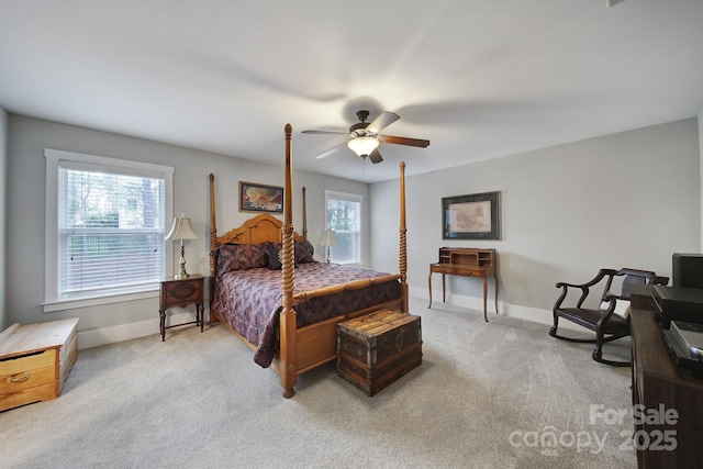bedroom with baseboards, light colored carpet, and ceiling fan