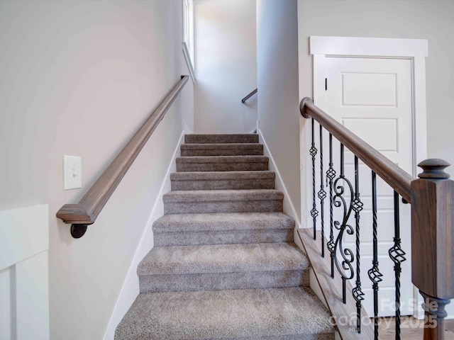 stairway with baseboards