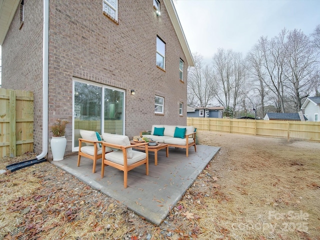 view of patio / terrace featuring an outdoor hangout area and a fenced backyard