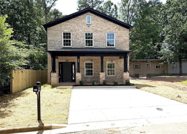 588 Washington Ln, Albemarle, NC 28001 - view of front of house featuring a porch, brick siding, and concrete driveway