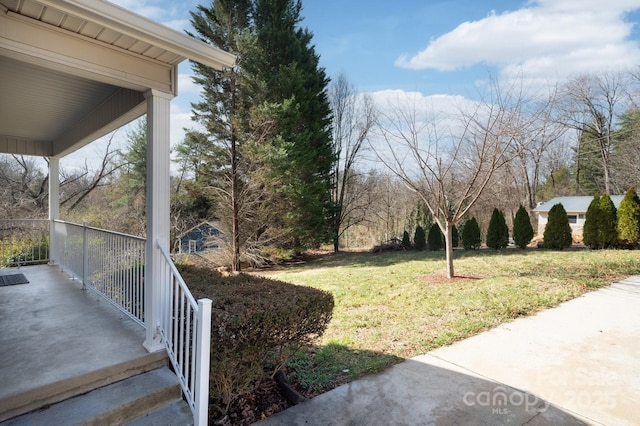 view of yard with covered porch