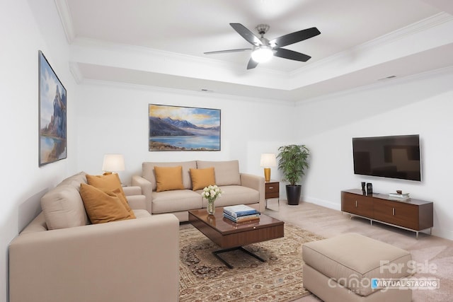 living area with baseboards, carpet flooring, ornamental molding, and a ceiling fan
