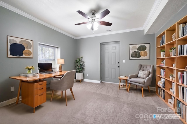 office space with crown molding, baseboards, visible vents, a ceiling fan, and light carpet