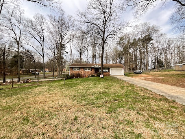 view of front of house featuring a garage, brick siding, concrete driveway, and a front lawn