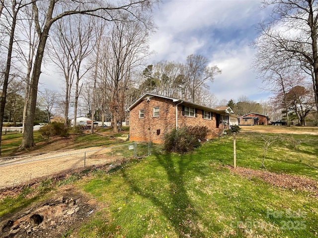 view of property exterior with a lawn and brick siding