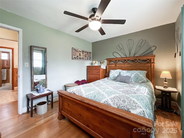 bedroom featuring light wood-style floors, baseboards, and ceiling fan