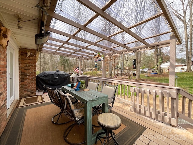 deck with area for grilling, a pergola, and outdoor dining area