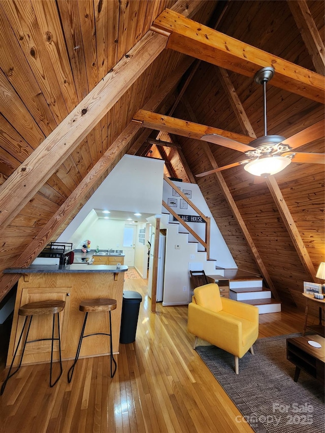 bonus room with lofted ceiling with beams, hardwood / wood-style floors, and wooden ceiling