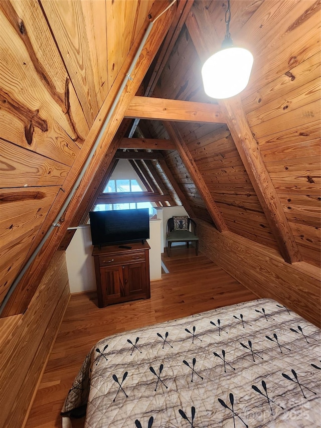 additional living space featuring wooden ceiling, wooden walls, wood finished floors, and vaulted ceiling with beams