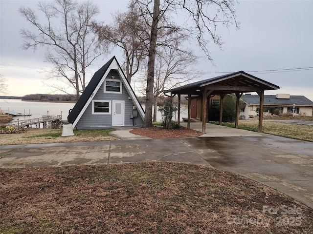 a-frame style home featuring a water view