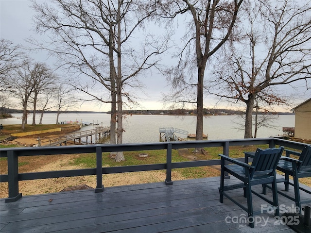 wooden terrace with a water view