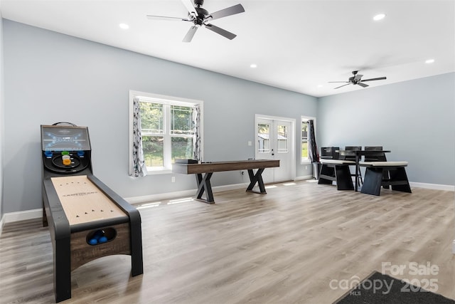 interior space with light wood finished floors, recessed lighting, french doors, and baseboards