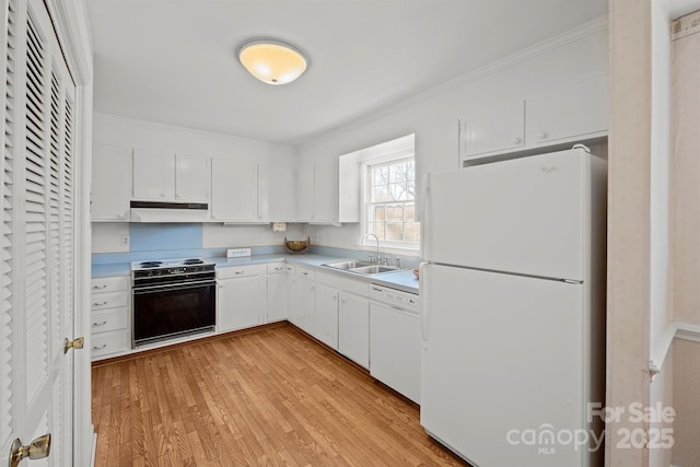 kitchen with white cabinetry, white appliances, under cabinet range hood, and a sink