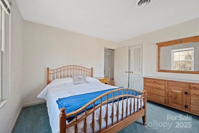 bedroom featuring light carpet, visible vents, baseboards, and a closet