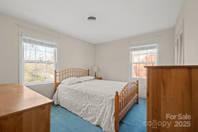 bedroom featuring visible vents and carpet floors