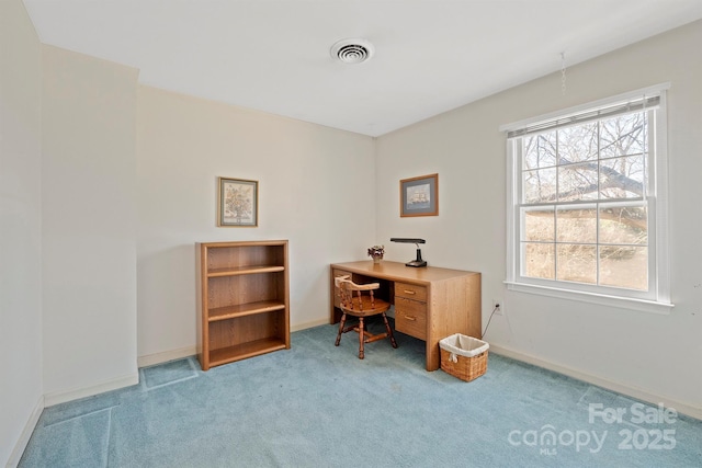 office featuring carpet flooring, baseboards, and visible vents