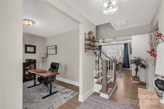 office space with baseboards and wood finished floors