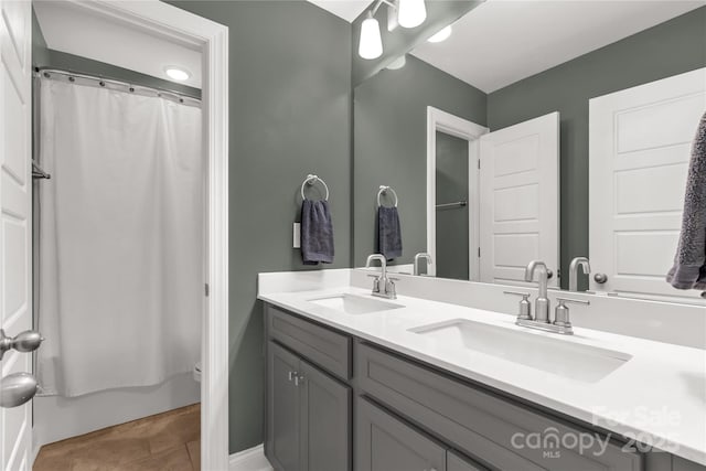 bathroom with double vanity and a sink