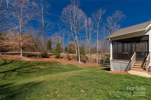 view of yard featuring a sunroom