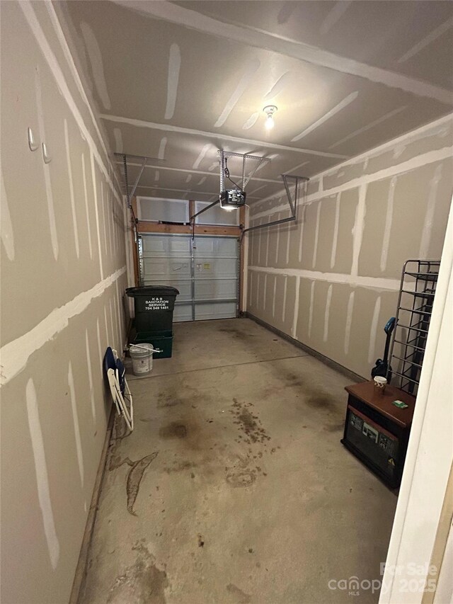 garage featuring a garage door opener