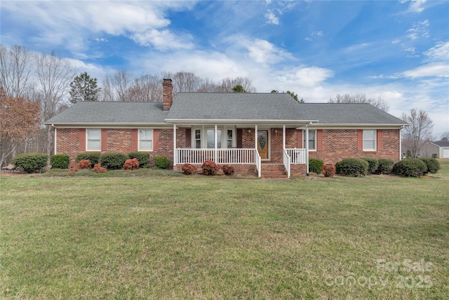 ranch-style home featuring a front yard, brick siding, covered porch, and a chimney