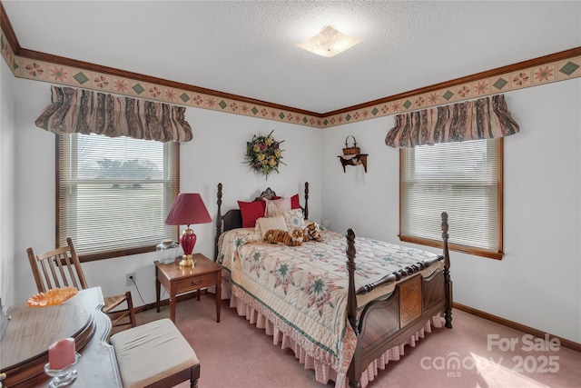 bedroom with a textured ceiling, crown molding, baseboards, and light carpet