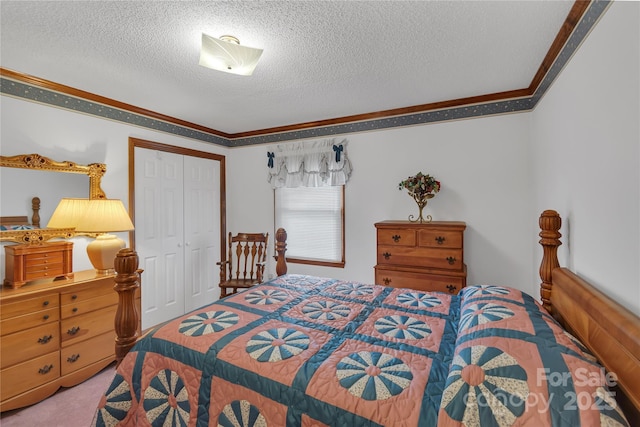 carpeted bedroom featuring a closet, a textured ceiling, and crown molding