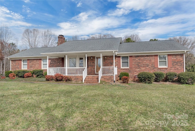 single story home featuring a front yard, brick siding, and a chimney