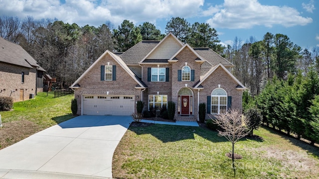 view of front of property with brick siding, concrete driveway, and a front yard